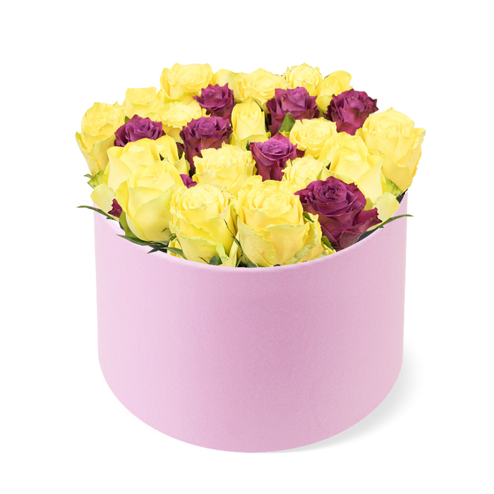 From a gently elevated viewpoint, this vibrant arrangement unfolds in a luxurious, round pastel pink gift box. The soft, matte finish and smooth curves cradle a dense crown of roses, the dome rising proudly above the rim. The bouquet is led by cheerful yellow roses, their petals perfectly formed and glowing with warmth, creating a sense of joy and optimism. Interspersed among them are deep burgundy or burgundy-red roses, providing a regal contrast that deepens the palette and invites closer inspection. The blooms are packed tightly, achieving a sculpted, abundant silhouette while pale green foliage remains minimal to keep the focus on the blossoms. The pink box itself adds to the premium feel, its rounded edges and refined finish complementing the contemporary presentation. Bright, clear lighting makes the colours pop against the white background, highlighting every petal's delicate texture. This arrangement reads as a sophisticated gift for modern celebrations, from birthdays and anniversaries to heartfelt expressions of affection that suit stylish interiors. In Stanmore and nearby Harrow districts, it stands as a dependable option for luxury delivery, ready to bring a refined touch to someone's day with fragrance and charm.