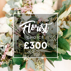This bespoke Florist Choice bouquet blooms in creamy whites and pale blush against a softly lit, natural background. The arrangement feels generous and relaxed, with several large, full-petaled blooms-garden roses, peonies, or perhaps chrysanthemums-interspersed with delicate white fillers such as lisianthus or campanula, and punctuated by tiny clusters of pale pink or mauve blossoms reminiscent of waxflower. Lush eucalyptus leaves, silvery-green and rounded, frame the bouquet while slender olive branches trace a quiet Mediterranean line through the design. Toward the center, a darker green, almost purplish ornamental kale or sculptural succulent adds an unexpected contemporary twist, anchoring the composition. The composition is styled in an organic, cut-flower fashion that feels fresh and inviting, as if gathered by hand from a Stanmore corner garden.

A crisp white rectangular frame sits across the middle, bearing Florist Choice. Florist in elegant script, CHOICE in uppercase sans-serif beneath it, and the bold '?300' in white below. The backdrop dissolves into peach-cream tones, making the bouquet glow with a refined, celebratory mood. The image communicates expert curation and premium quality, ideal for premium delivery across Stanmore and NW London, whether for anniversaries, weddings, or thoughtful gifts. Delivery in Stanmore and surrounding neighborhoods is available for same-day orders, ensuring freshness and personal touch. This is a bouquet that speaks of confident taste, a refined gesture that makes celebrations feel intimate and memorable in our quiet NW London suburb.