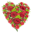 This image depicts a deeply expressive, heart-shaped floral arrangement that has clearly been crafted as a sympathy or funeral tribute, photographed against a smooth white backdrop. The heart is dominated by intense red tones, beginning with six large roses placed thoughtfully across the design. Their petals are velvety and rich, curling tightly at the centres and gradually opening outward, suggesting layers of memory and emotion. Filling every space around them, densely packed red carnations create a plush, ruffled carpet of colour that defines the heart's rounded curves and central fullness. Among this sea of red, clusters of lime-green button chrysanthemums appear in regular intervals, their small, perfectly rounded flower heads introducing a bright, almost luminous contrast that enlivens the entire piece. Framing the composition, sprigs of variegated foliage with green centres and pale, creamy edges trace the outline of the heart, softening the transition between flowers and air and sharpening the visual shape. At the narrow base of the heart, a few fine fern fronds extend beyond the blooms, giving a light, airy flourish that suggests movement and gentleness. The lighting is even and soft, revealing the natural sheen of the rose petals and the crisp edges of each leaf. This floral heart would be a fitting tribute for a memorial service in Stanmore, whether placed at the front of a chapel, near a photograph of the departed, or carried as part of a funeral procession. It conveys a message of profound love, compassion, and remembrance, offering comfort to those gathered to say a final farewell.