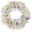 A graceful, round funeral wreath is shown in full against a plain white background, its delicate flowers standing out in quiet relief. The wreath is constructed from a thick ring of Baby's Breath, so tightly clustered that the individual blooms merge into a soft, cloud-like band of white. Each tiny flower contributes to a sense of lightness, reminiscent of soft clouds drifting over the rooftops and gardens of Stanmore. Threaded throughout this airy base are elegant Lisianthus blossoms, their fuller forms rising gently from the Gypsophila. The Lisianthus petals are a luminous white, their edges and subtle veins washed with shades of lavender and violet, creating a gentle, almost watercolour-like effect. Some of the flowers have opened wide, their centers deeper and slightly shadowed; others remain unfurled buds or partially opened blooms, with hints of pale green stems and creamy tips adding a touch of natural variation to the composition. The contrast between the small, starry Baby's Breath and the larger, ruffled Lisianthus brings depth and detail, yet the overall feeling remains calm and unified. No leaves, bows, or other decorations intrude upon the simple elegance of the floral ring. The open central space forms a clear, tranquil circle, often associated with eternity, unity, and enduring love. This is the kind of gentle tribute frequently chosen in Stanmore for funeral services and memorial gatherings, a floral expression that offers quiet comfort and a sense of peace to family and friends as they say their goodbyes.